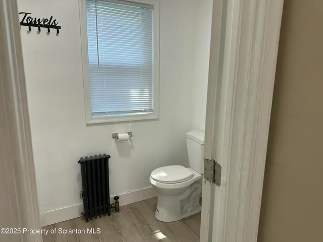 a bathroom with a toilet and a sink