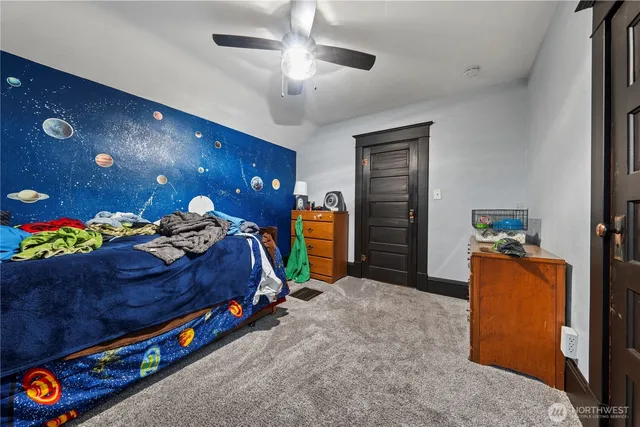 a bedroom with bed and window