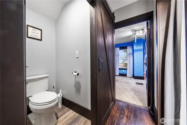 a view of a bathroom from a hallway