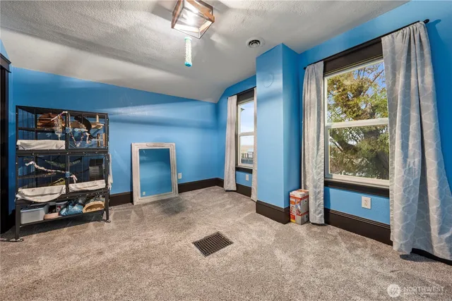 a view of livingroom with furniture and windows
