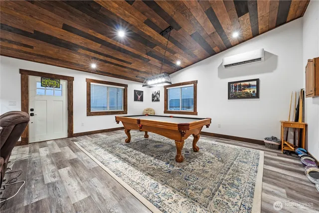 a living room with chair furniture and a wooden floor