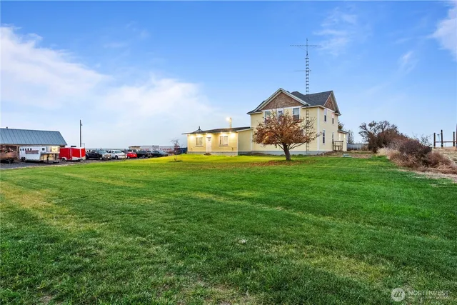 a big yard with table and chairs