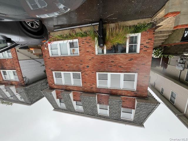 a front view of a house with parking space