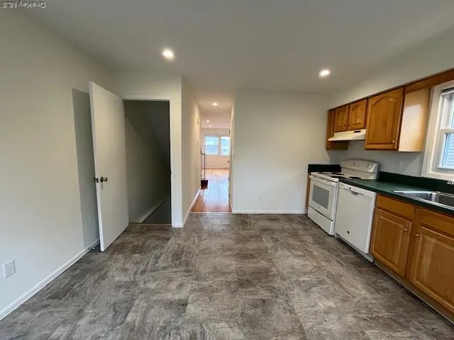 a view of a kitchen with electric appliances
