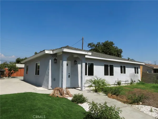 front view of a house with a yard
