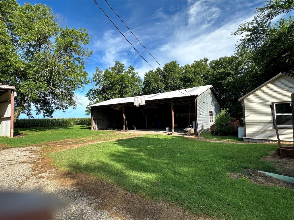 604 Harrel Avenue Bynum, TX 76631 - Photo 8 of 24 a view of a backyard with a garden