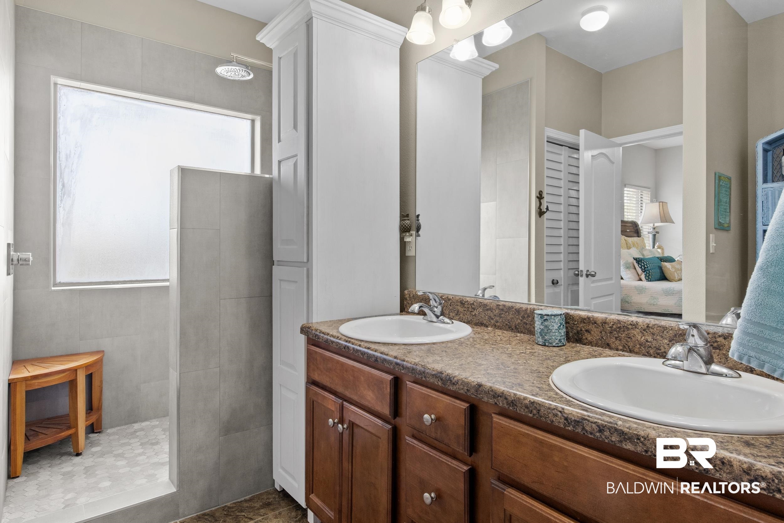 1752 Abbey Loop Foley, AL 36535 - Photo 10 of 21 Bathroom featuring tile patterned floors, vanity, and a tile shower