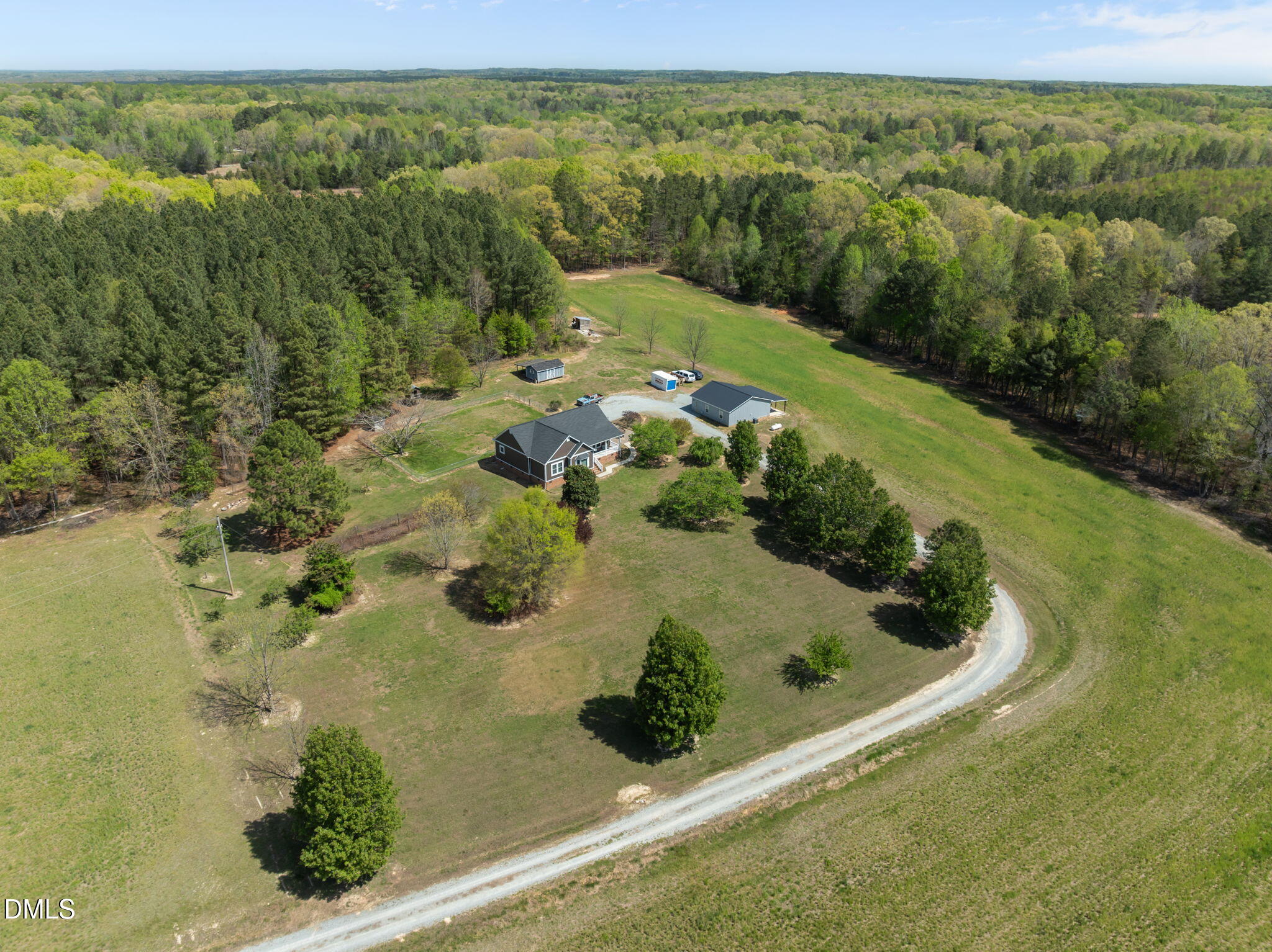 236 Dirgie Mine Road Roxboro, NC 27574 - Photo 5 of 55 a view of a garden with a lake view