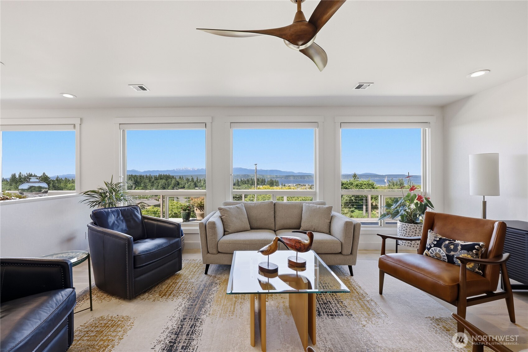 37709 Olympic View Road Northeast Hansville, WA 98340 - Photo 8 of 40 a living room with furniture and a large window