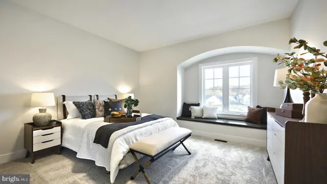 a bedroom with a bed and a couch