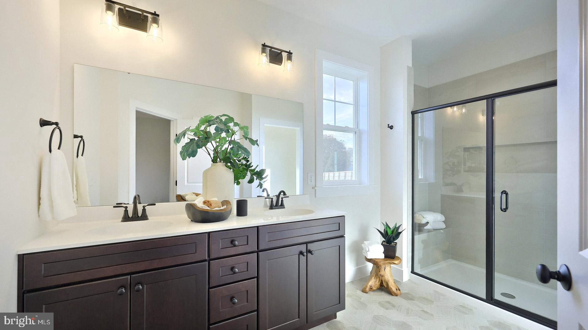 23 Vista Court Lititz, PA 17543 - Photo 16 of 27 a bathroom with a double vanity sink mirror and shower