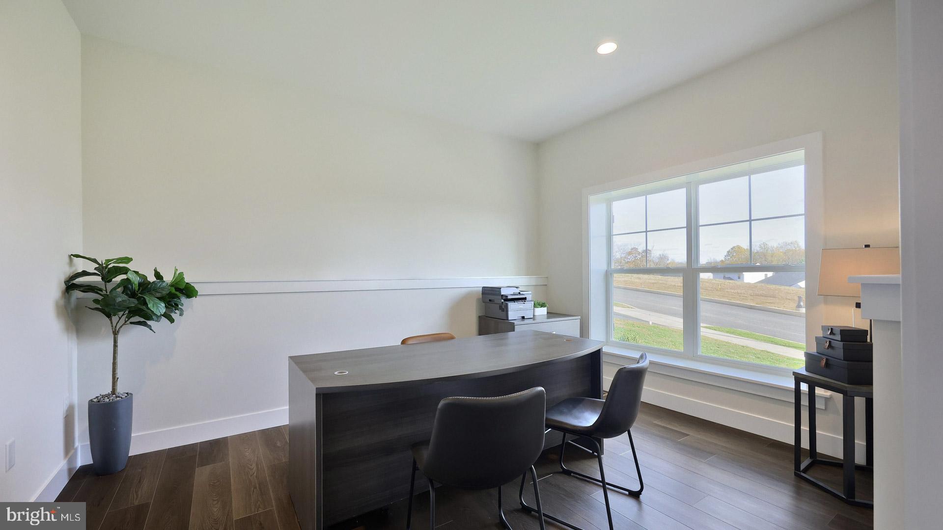 23 Vista Court Lititz, PA 17543 - Photo 18 of 27 a view of a workspace room with furniture and a potted plant