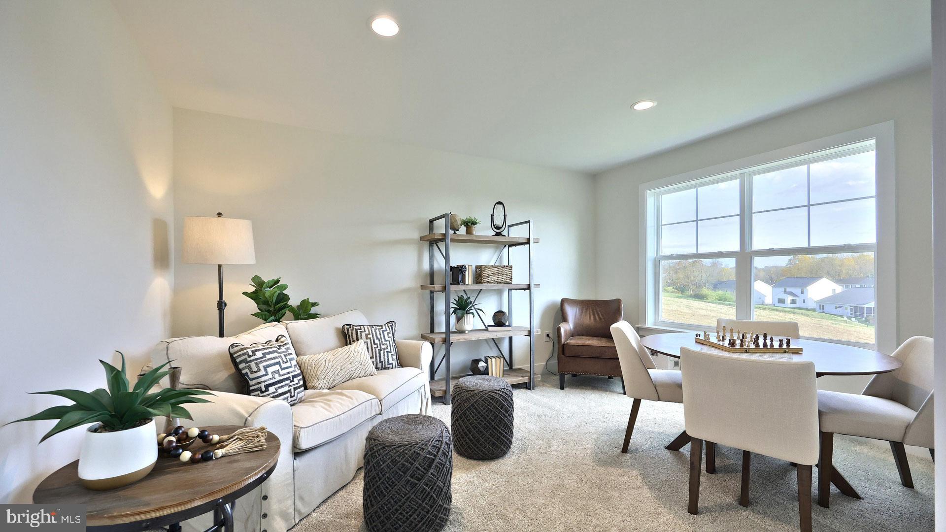 23 Vista Court Lititz, PA 17543 - Photo 21 of 27 a living room with furniture potted plant and a window