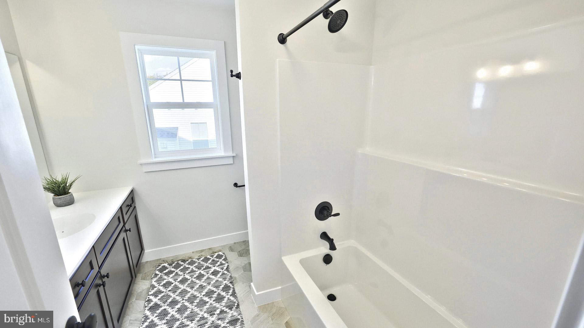 23 Vista Court Lititz, PA 17543 - Photo 26 of 27 a bathroom with a bathtub and shower