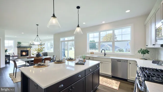 a kitchen with counter space and windows