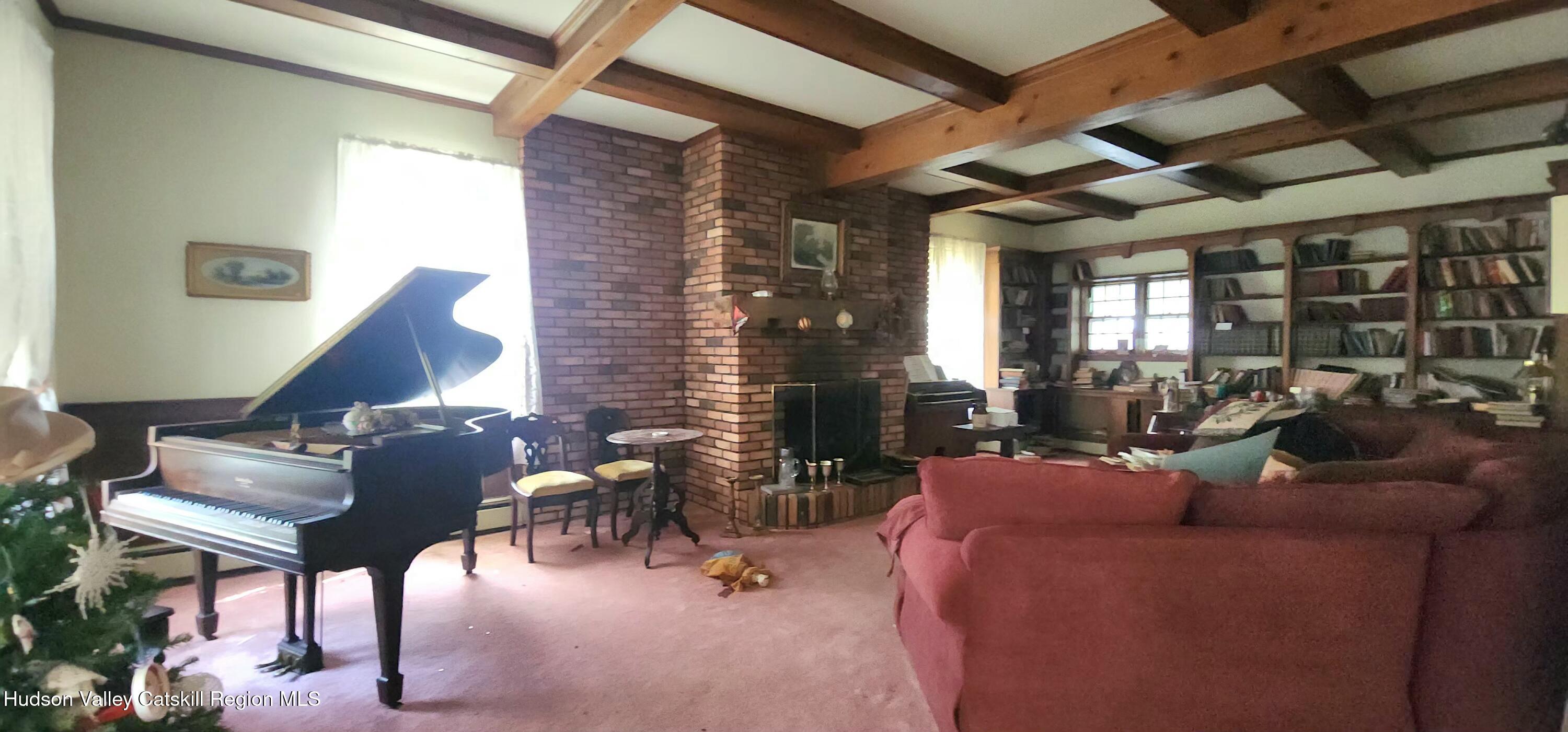 293 Carl Road Jewett, NY 12444 - Photo 12 of 20 a living room with furniture and wooden floor
