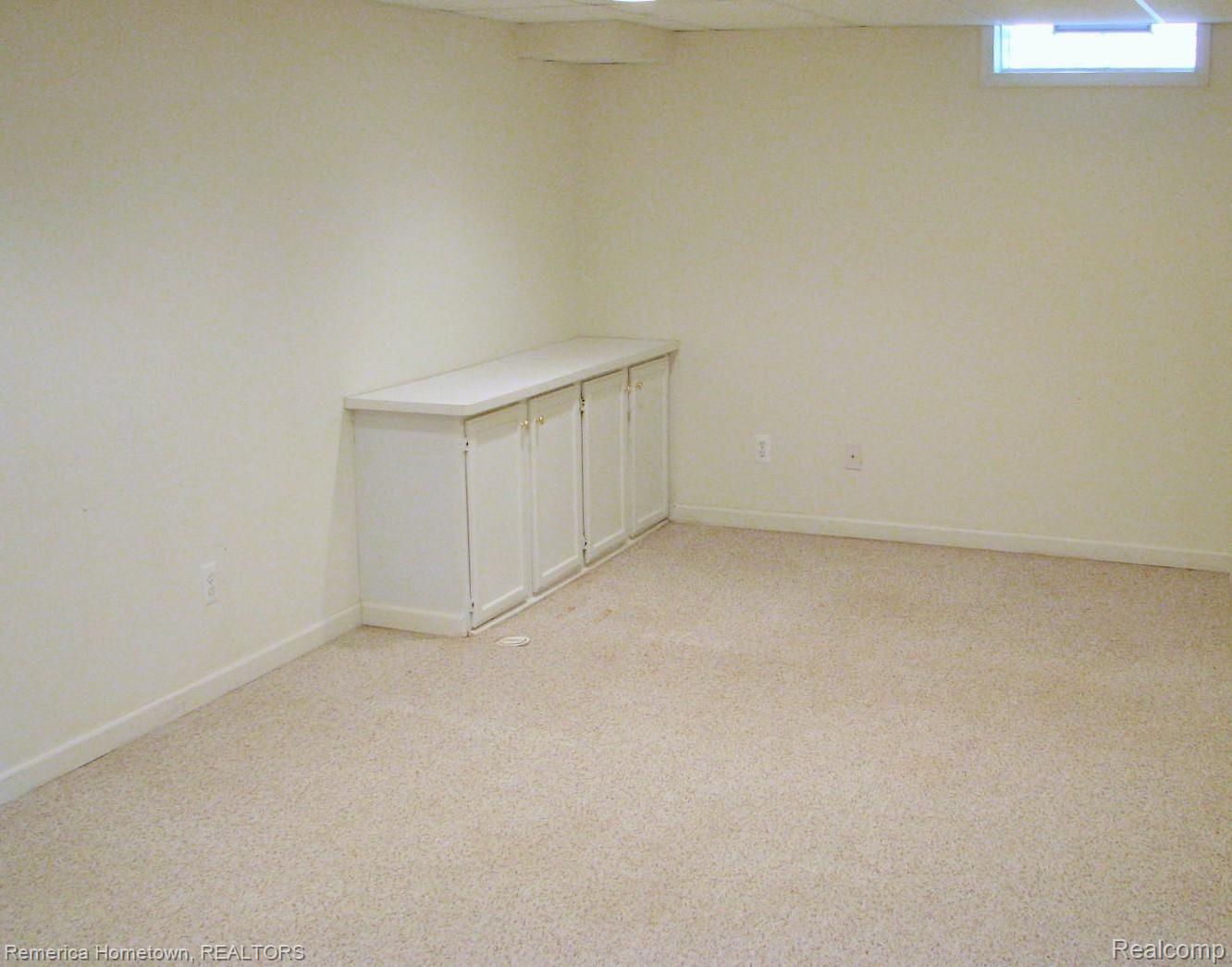 46727 Doubletree Road Canton, MI 48187 - Photo 20 of 22 A snapshot of the NE corner of the finished basement. Upgraded block windows complete with vents.