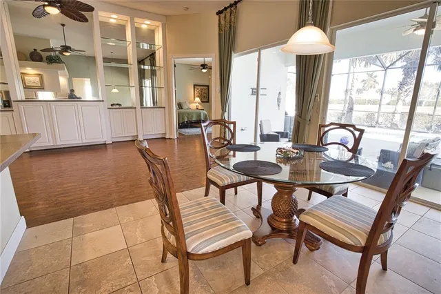 a dining room with furniture and wooden floor