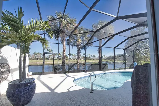 a view of swimming pool with a outdoor seating