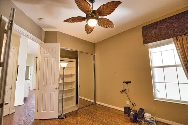a view of a livingroom with a window and furniture