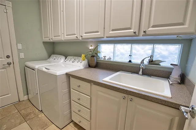 a kitchen with cabinets and window