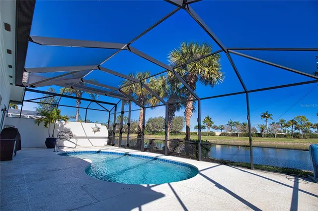 a view of a swimming pool with a patio