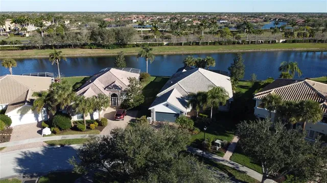 an aerial view of residential houses and outdoor space