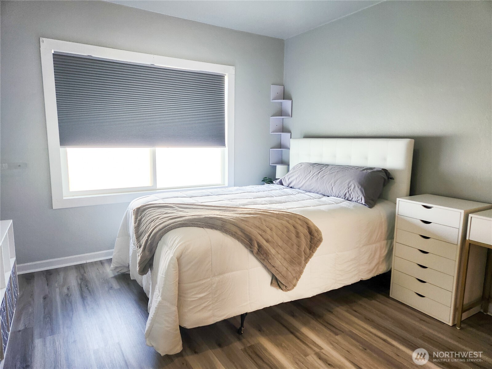 112 East 5th Street Lind, WA 99341 - Photo 12 of 39 a bedroom with a bed and a window