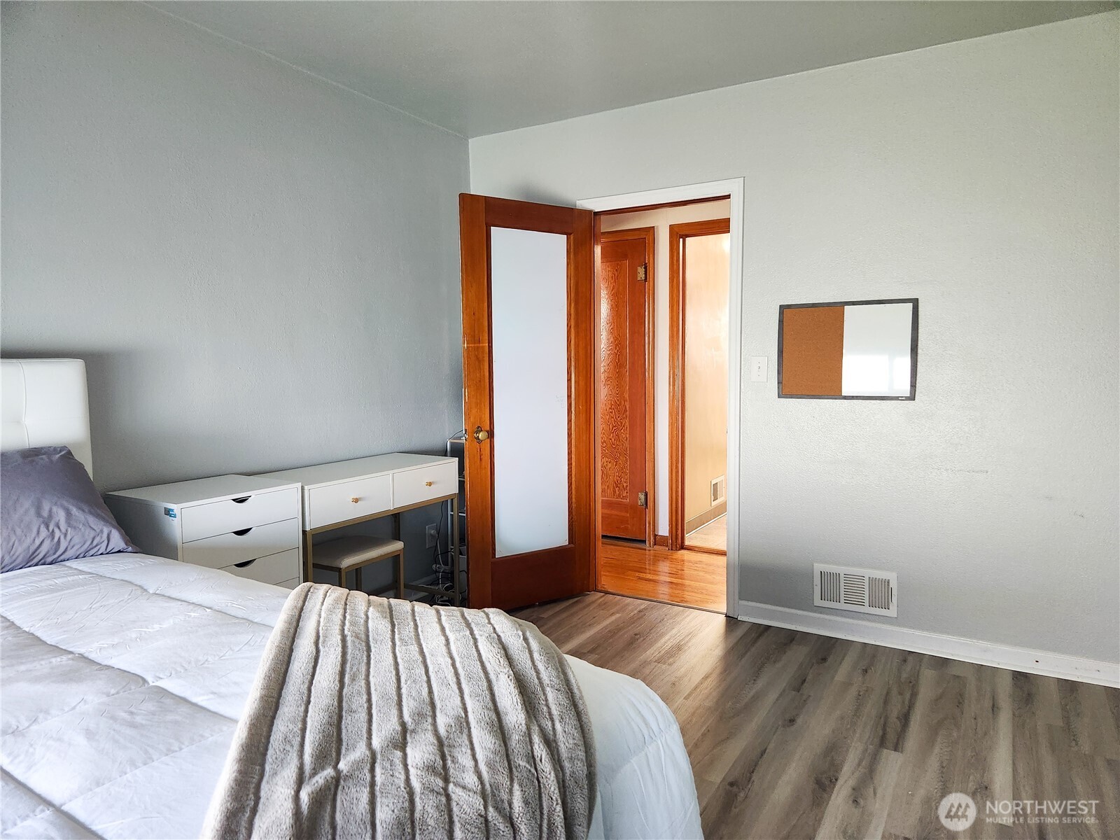 112 East 5th Street Lind, WA 99341 - Photo 13 of 39 a bedroom with a bed and wooden floor