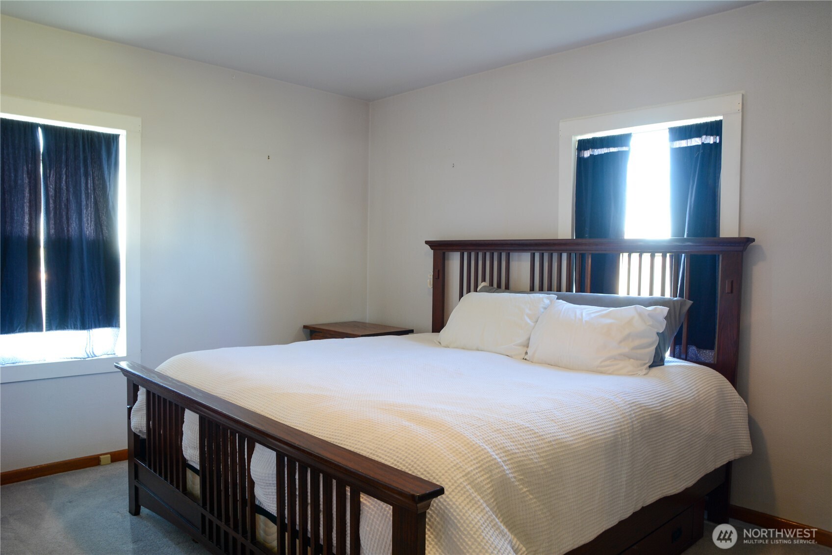 112 East 5th Street Lind, WA 99341 - Photo 14 of 39 a bedroom with a bed and a window