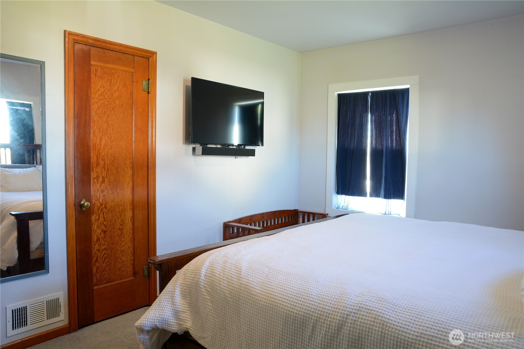 112 East 5th Street Lind, WA 99341 - Photo 15 of 39 a bedroom with a bed and a flat screen tv