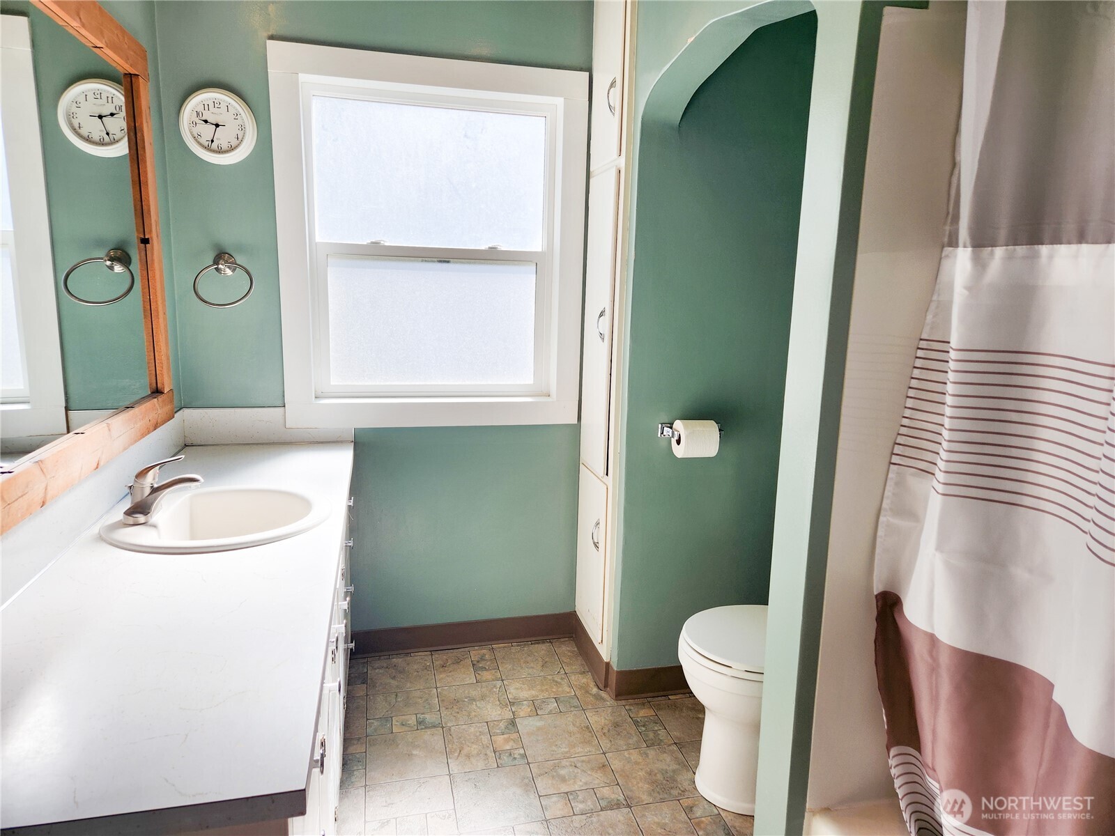 112 East 5th Street Lind, WA 99341 - Photo 17 of 39 a bathroom with a sink a toilet and a mirror