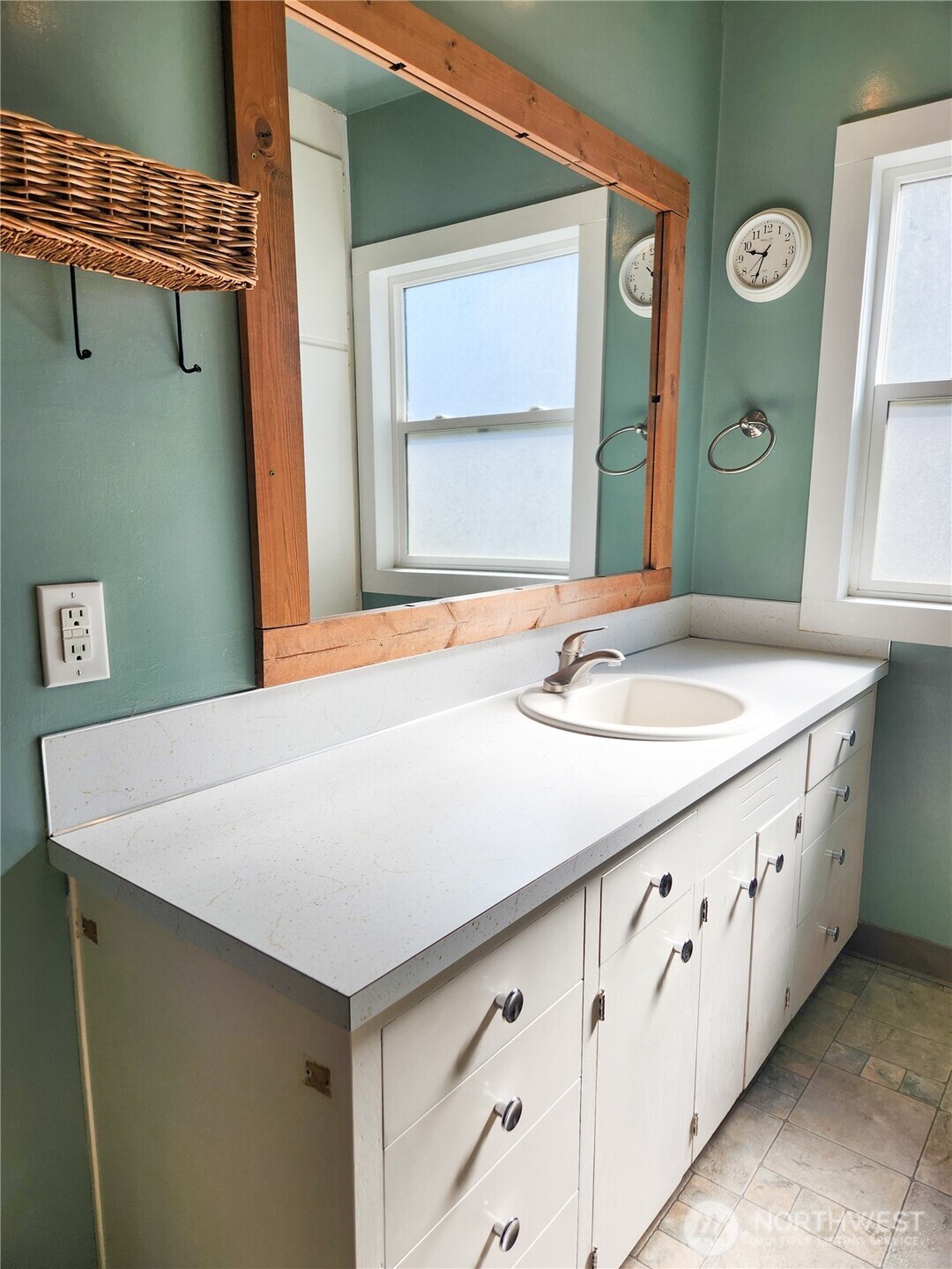 112 East 5th Street Lind, WA 99341 - Photo 18 of 39 a bathroom with a granite countertop sink and a mirror
