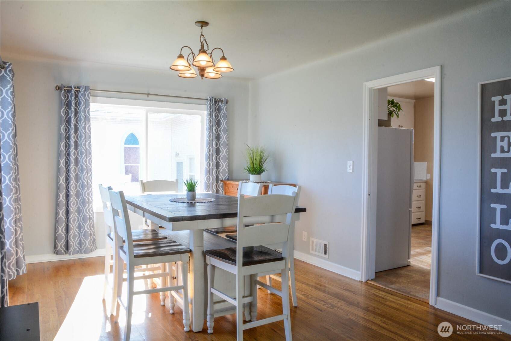 112 East 5th Street Lind, WA 99341 - Photo 2 of 39 a view of a dining room with furniture and chandelier