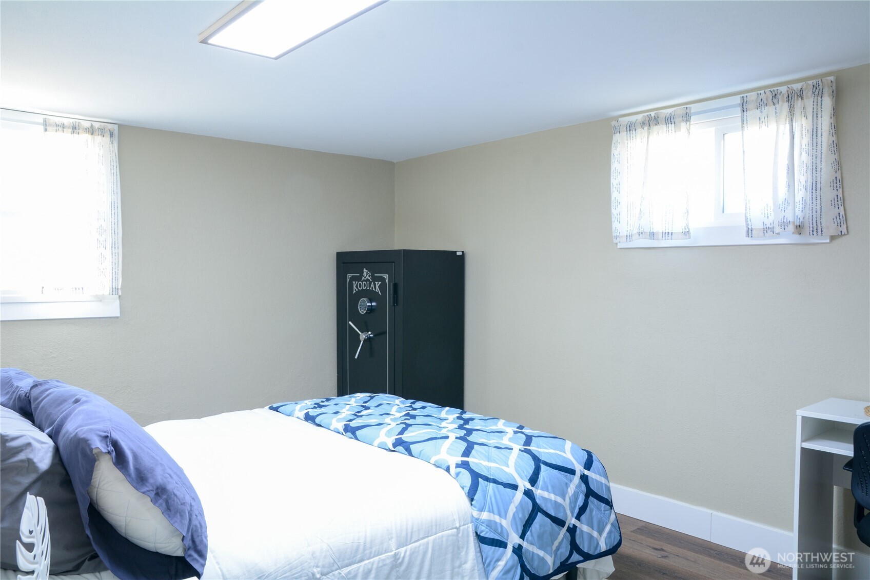 112 East 5th Street Lind, WA 99341 - Photo 29 of 39 a bedroom with a bed and wooden floor