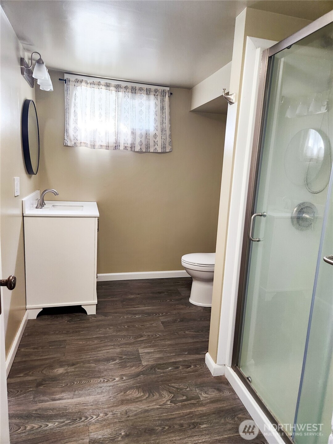 112 East 5th Street Lind, WA 99341 - Photo 32 of 39 a bathroom with a sink a toilet and mirror