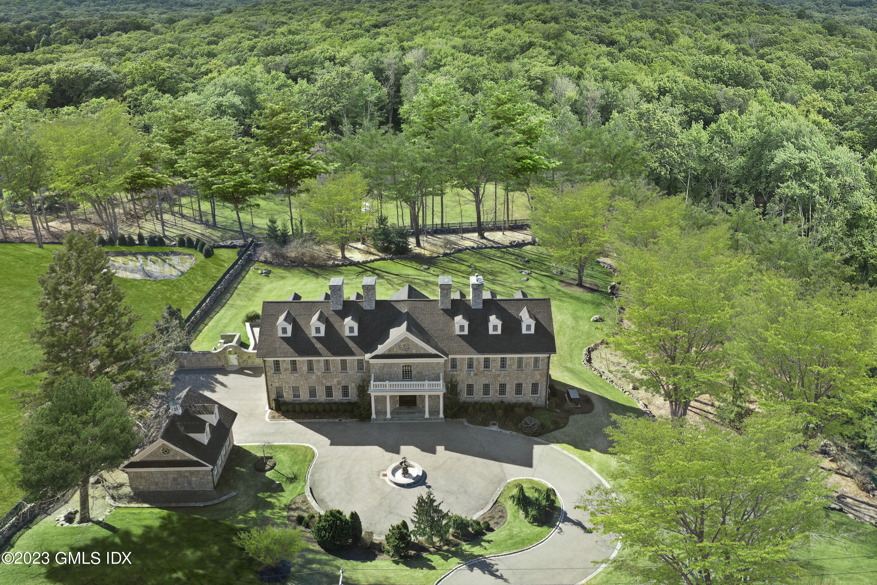 a view of yard with green space and seating area