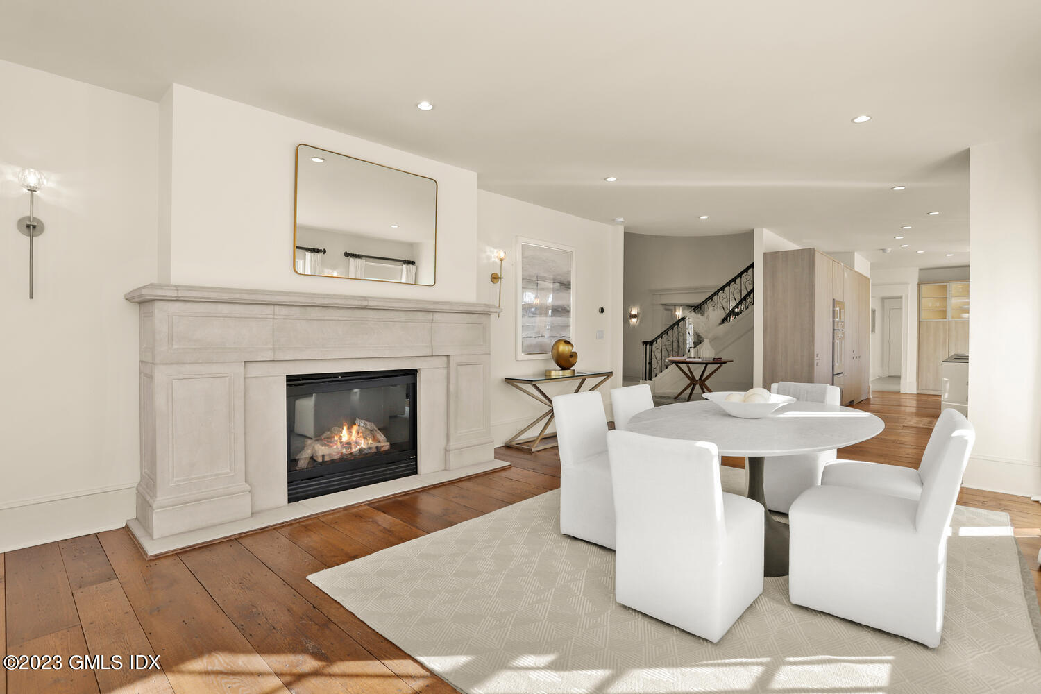 28 Dairy Road Greenwich, CT 06830 - Photo 18 of 44 a living room with a fireplace a table and a fireplace