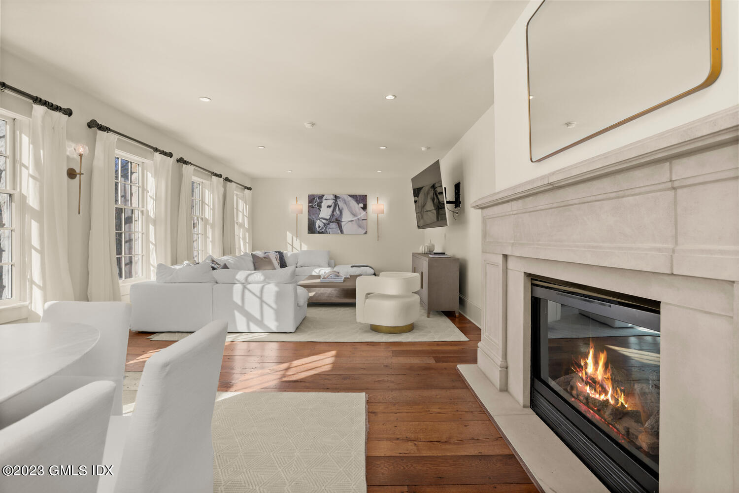 28 Dairy Road Greenwich, CT 06830 - Photo 19 of 44 a living room with furniture large window and fireplace