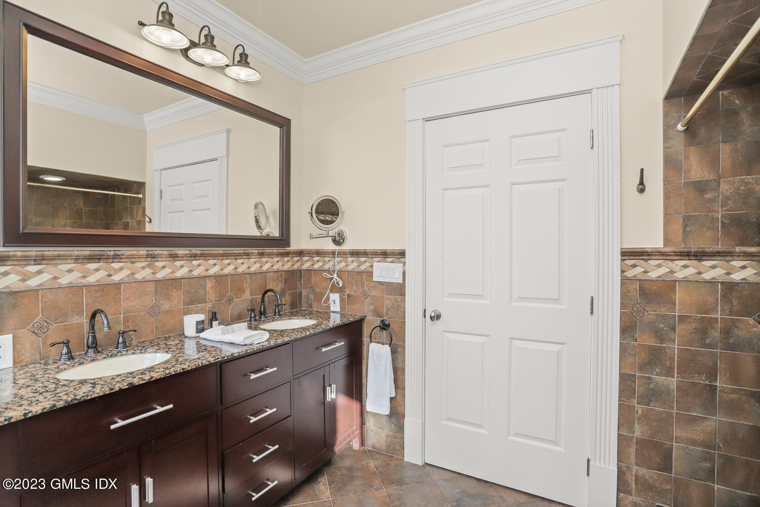 28 Dairy Road Greenwich, CT 06830 - Photo 33 of 44 a bathroom with a granite countertop sink a mirror and a shower