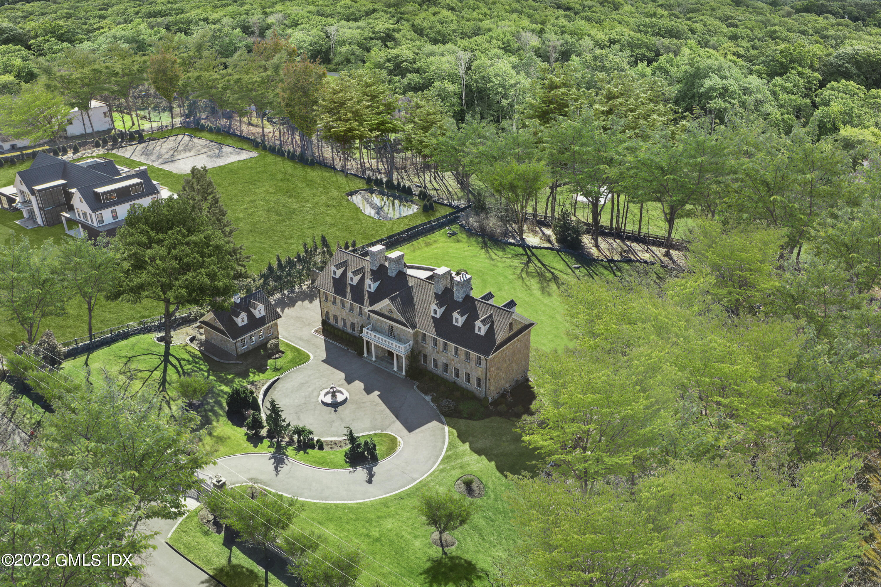 28 Dairy Road Greenwich, CT 06830 - Photo 40 of 44 an aerial view of a house with a yard