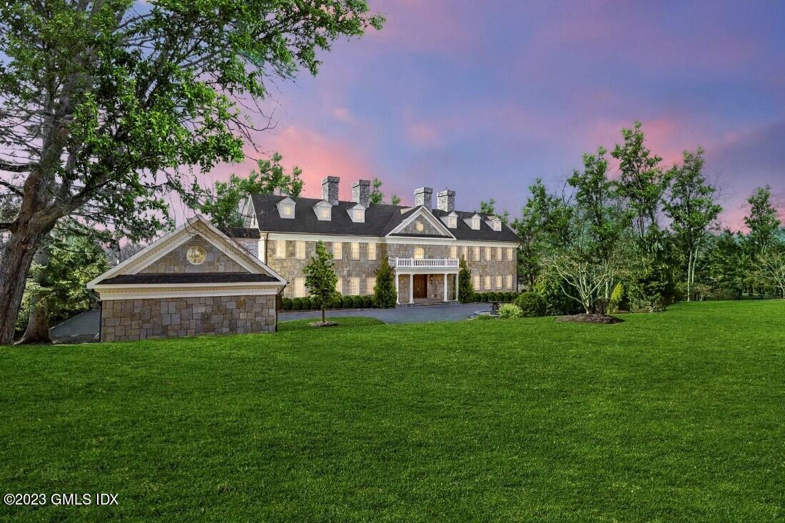 28 Dairy Road Greenwich, CT 06830 - Photo 4 of 44 a front view of a house with garden