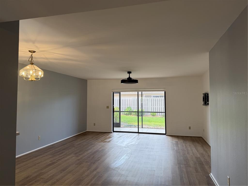 2004 Longpointe Circle Venice, FL 34293 - Photo 28 of 54 an empty room with wooden floor and windows