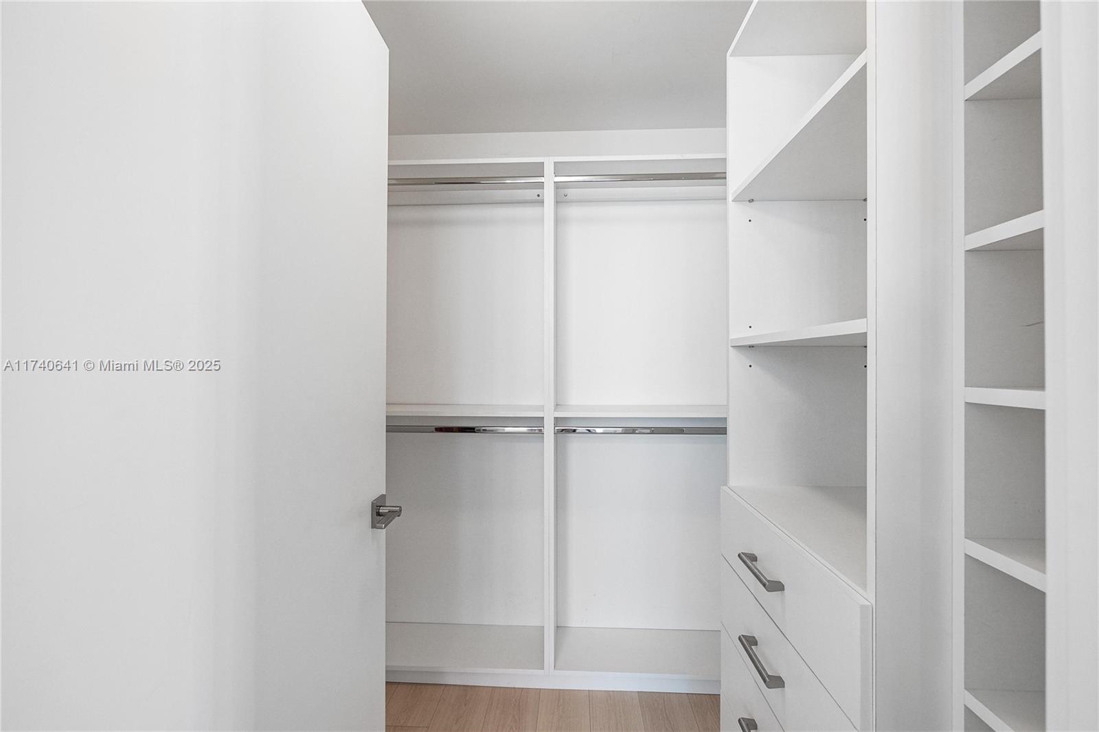 1 Collins Avenue, Unit 304 Miami Beach, FL 33139 - Photo 21 of 40 a view of walk in closet with empty racks