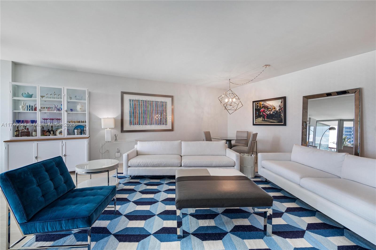 1 Collins Avenue, Unit 304 Miami Beach, FL 33139 - Photo 4 of 40 a living room with furniture and a rug