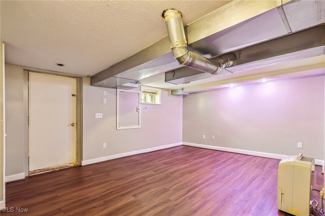 23 Lane Street Rittman, OH 44270 - Photo 11 of 34 Below grade area with wood finished floors and a textured ceiling