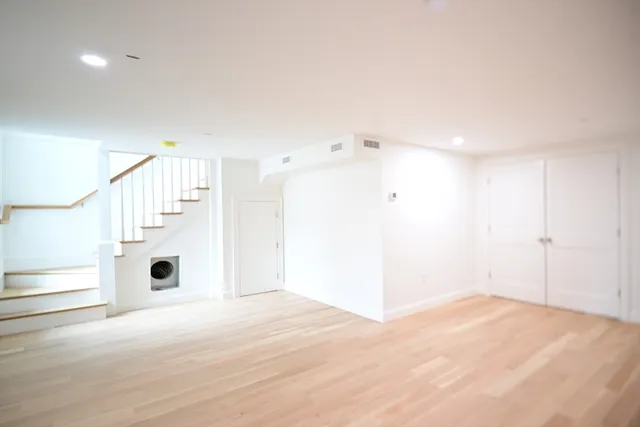 a view of entryway with wooden floor