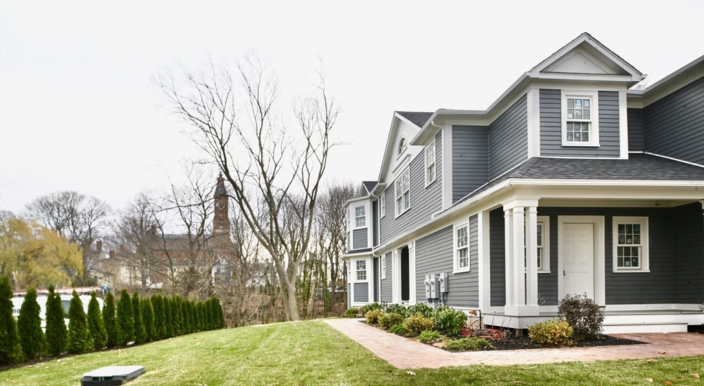 66 Pleasant Street, Unit 1 Marblehead, MA 01945 - Photo 3 of 19 a front view of a house with a yard