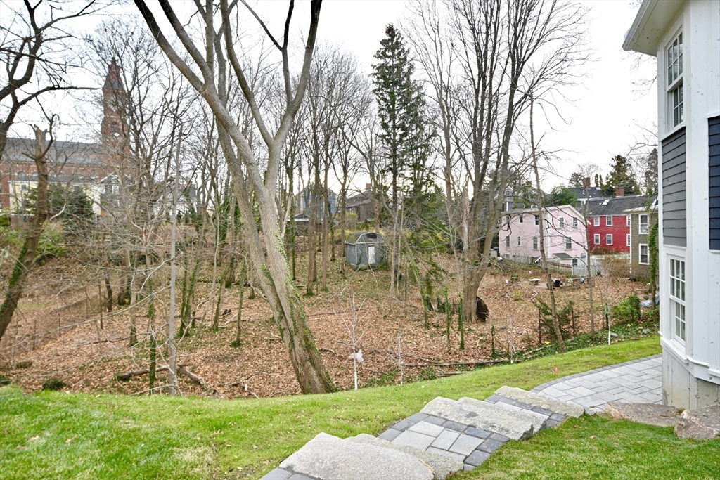 66 Pleasant Street, Unit 1 Marblehead, MA 01945 - Photo 4 of 19 a view of backyard with green space
