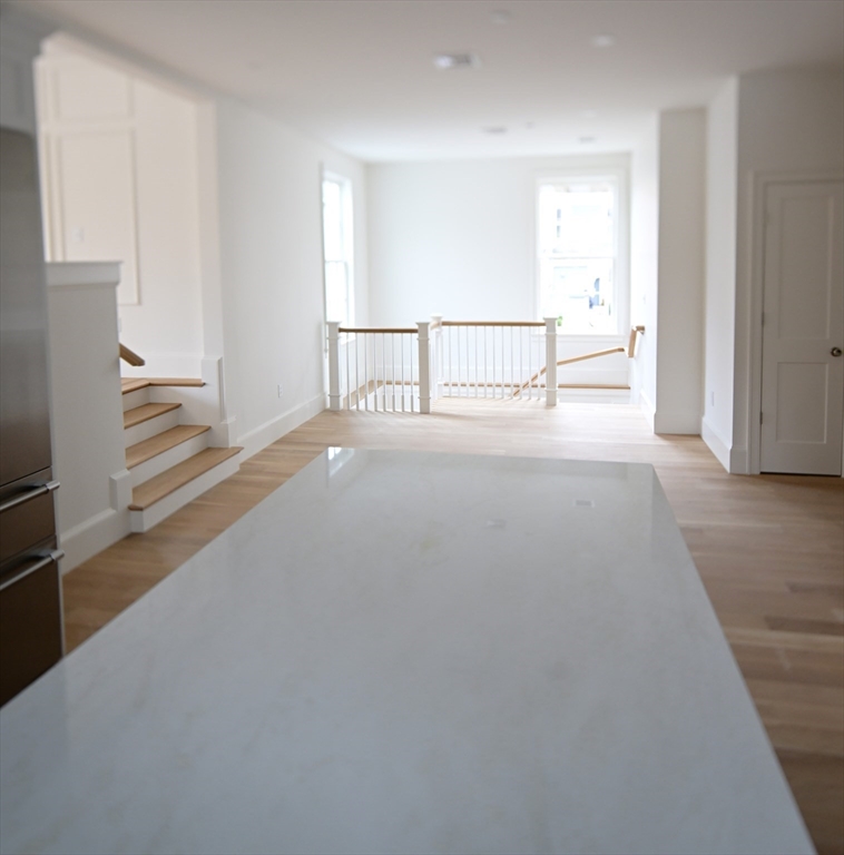 66 Pleasant Street, Unit 1 Marblehead, MA 01945 - Photo 10 of 19 a view of hallway with stairs